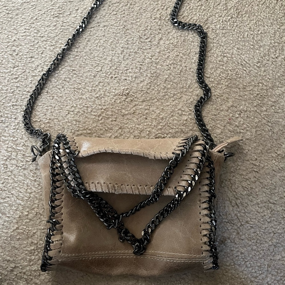 Taupe leather purse with long strap & two shoulder straps that fold the flaps